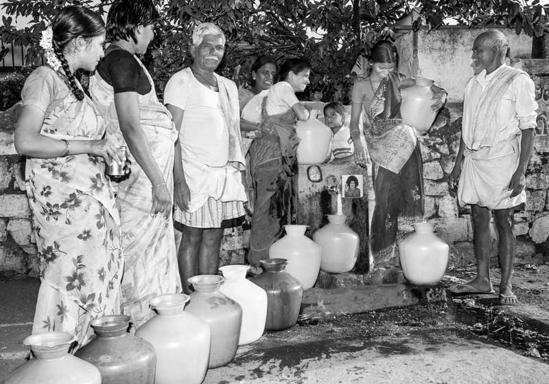 Queue and Rush for Drinking Water - Men and women lined up at a public standpoint in a village in Anantapur district, Andhra Pradesh